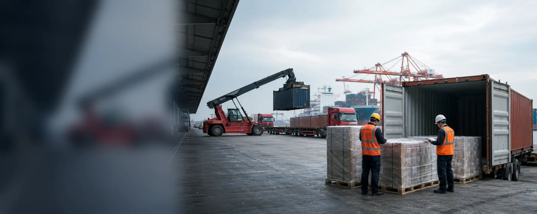 Logistics staff inspecting palletized cargo before container loading in China